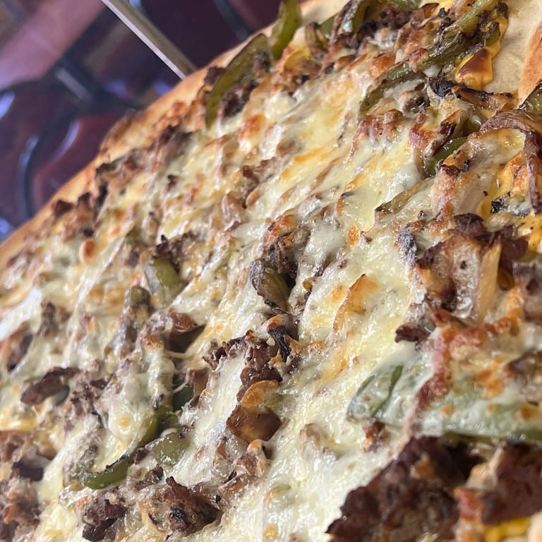 Indulge in Our Cheesesteak
